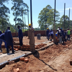 Trainees at Nyamira National Polytechnic construct the institution's Building and Civil Engineering Workshop as part of their training. Photo: State Department for TVET.